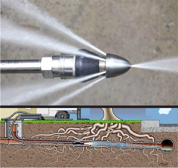 Plumbing technician performing hydro jetting on a sewer line